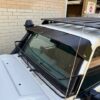 Toyota 70-79 Series Landcruiser (with factory snorkel) Black Windscreen Stone Guard and Mesh Sunvisor Bundl...